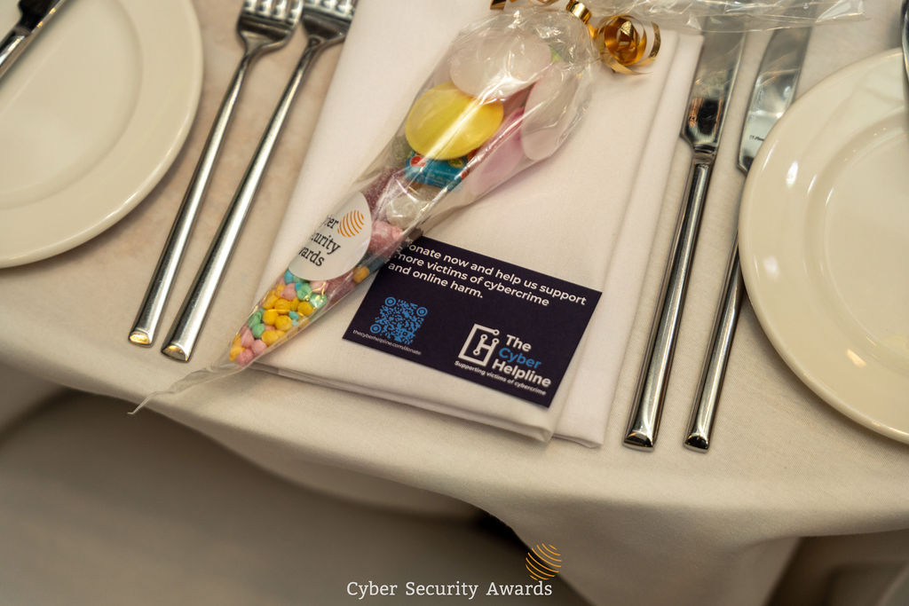 A place setting at the Cyber Security Awards ceremony with a Cyber Helpline charity favour