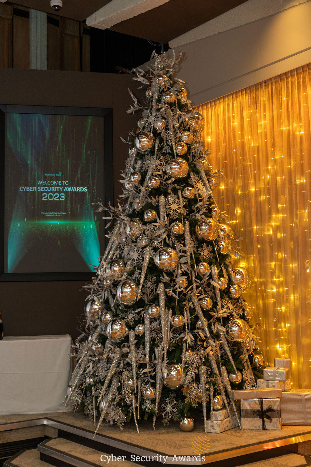 The lit stage carrying the Cyber Security Awards 2023 screen, where each winner is called up